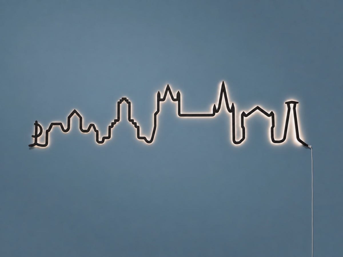 Kontura Skyline Lausanne in Schwarz, beleuchtet an der Wand #Farbe_Schwarz